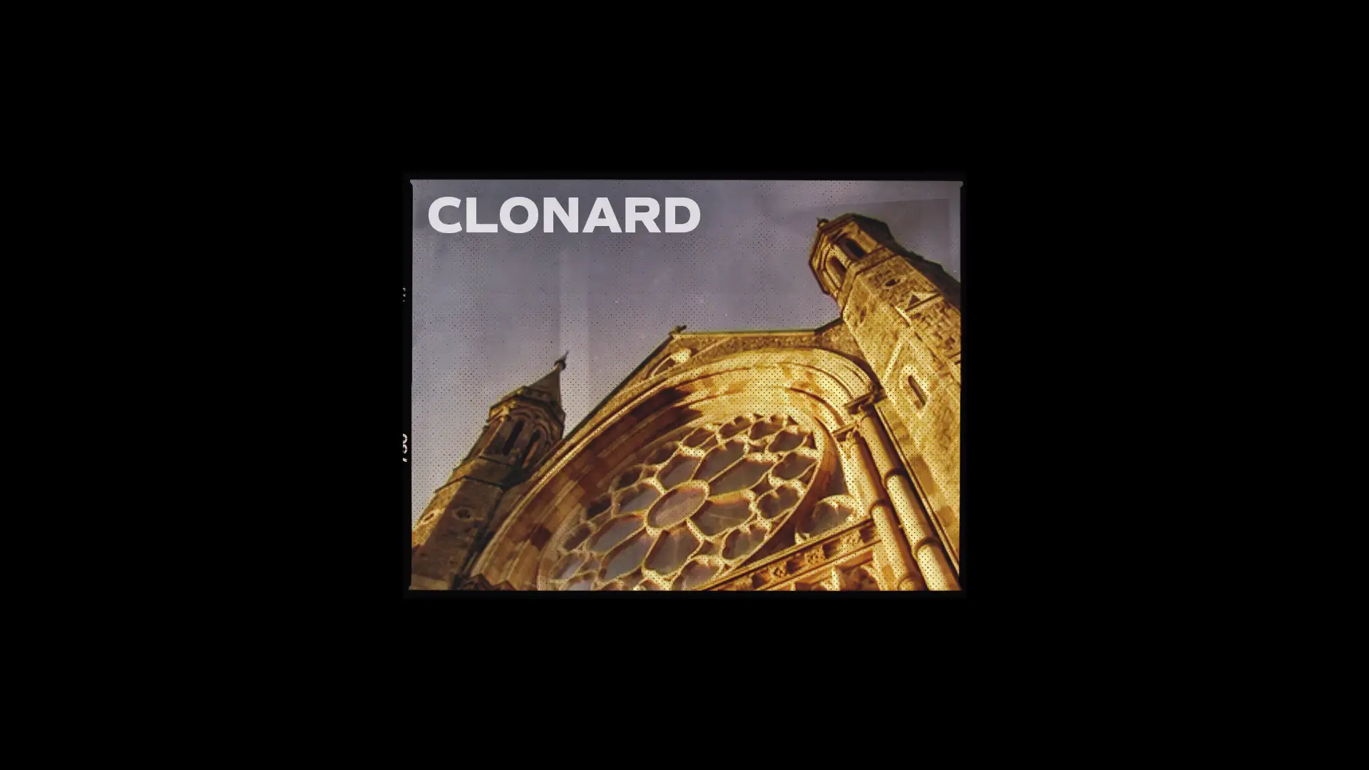 A warm, golden-toned image of the Clonard Monastery facade, highlighting its intricate rose window and towers as part of a brand development project.