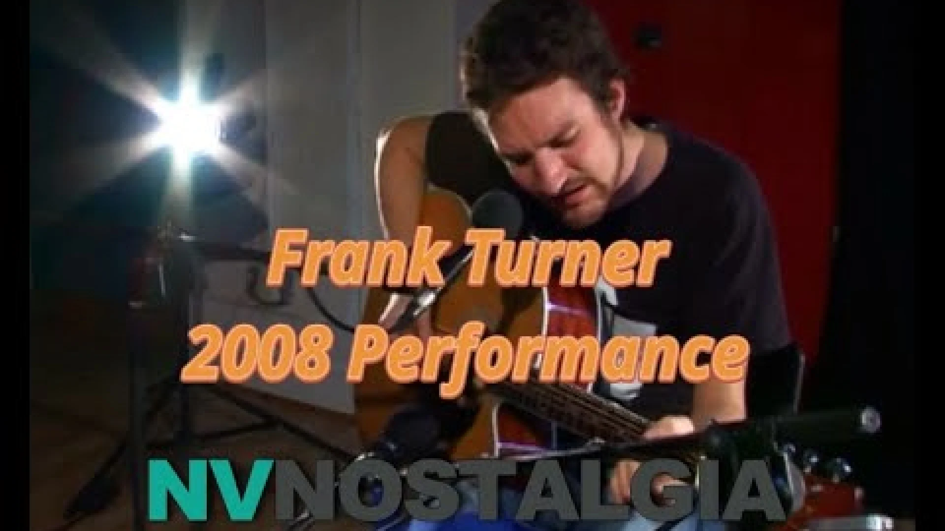 Musician Frank Turner playing an acoustic guitar and singing into a microphone during a 2008 performance poster.
